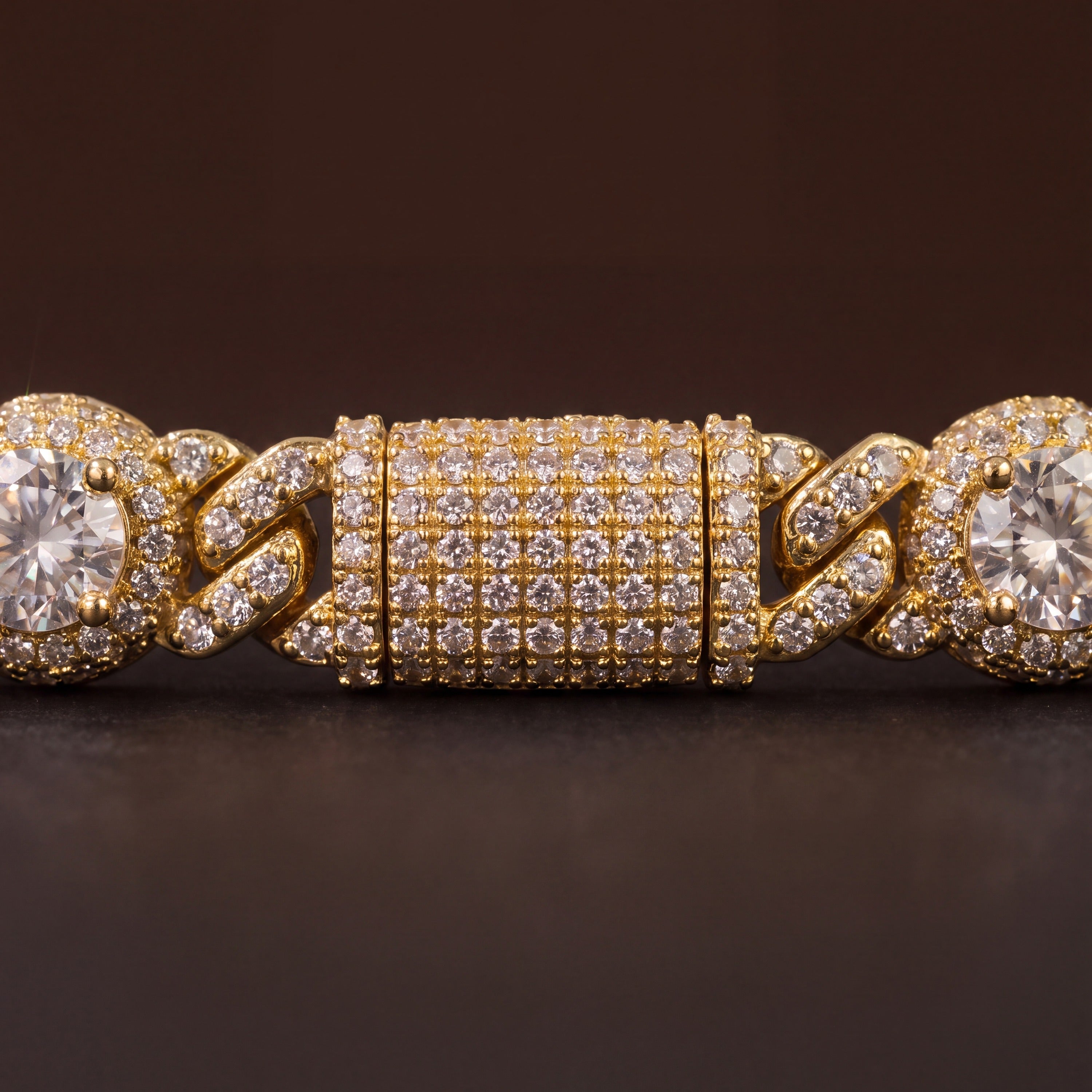 Close-up of the pave box clasp on the gold-tone halo station bracelet
